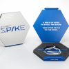 Peeksteep Spike Packing Tool, blue. Shown inside of the box