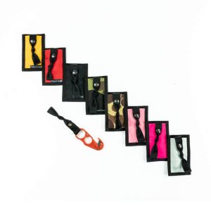Z-Knife made by paragear. Small orange knife with different pouches: yellow, red, multicam, pink, neon pink, black