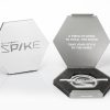 Peeksteep Spike Packing Tool, white. Shown inside of the box